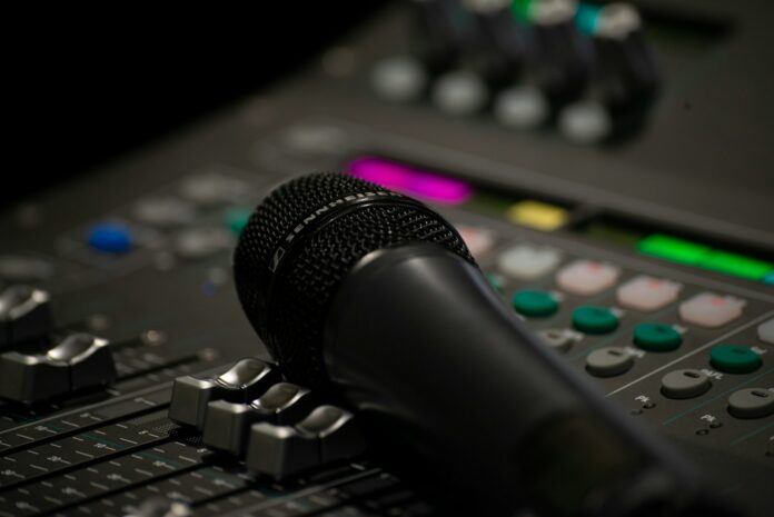 black microphone on black audio mixer